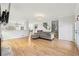 Living room with hardwood floors, fireplace, and open concept to the kitchen at 716 Connally Se St, Atlanta, GA 30315