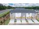 Aerial view of townhomes with decks, garages, and landscaping at 979 Cades Walk, Lawrenceville, GA 30045