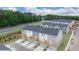 An aerial view of townhomes with decks and attached garages at 979 Cades Walk, Lawrenceville, GA 30045