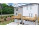 Two-story townhomes with balconies overlooking a fenced backyard at 979 Cades Walk, Lawrenceville, GA 30045