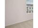 Empty bedroom with neutral walls, carpeted floors, and a window with blinds at 979 Cades Walk, Lawrenceville, GA 30045
