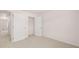 Open bedroom with carpet flooring and white walls, featuring closet access at 979 Cades Walk, Lawrenceville, GA 30045