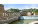 Inverness at Sugarloaf community entrance with stone monument and water feature at 979 Cades Walk, Lawrenceville, GA 30045