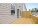 Wooden deck attached to a home, with siding and a window visible at 979 Cades Walk, Lawrenceville, GA 30045