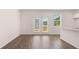 Dining area with sliding glass doors to a balcony, filled with natural light at 979 Cades Walk, Lawrenceville, GA 30045