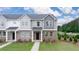 New construction home with brick and siding exterior, front yard, and walkway at 979 Cades Walk, Lawrenceville, GA 30045