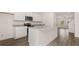 Spacious kitchen with island, stainless steel appliances, and ample counter space at 979 Cades Walk, Lawrenceville, GA 30045