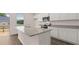 Bright, modern kitchen featuring white shaker cabinets, granite countertops, and stainless steel appliances at 979 Cades Walk, Lawrenceville, GA 30045