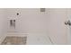 Laundry room with washer/dryer hookups and tiled flooring at 979 Cades Walk, Lawrenceville, GA 30045