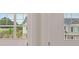 Closed windows with blinds, view of other houses outside at 979 Cades Walk, Lawrenceville, GA 30045