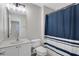 Bathroom with shower and navy and white striped shower curtain at 1081 Liberty Pkwy, Atlanta, GA 30318