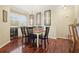 Charming dining room with hardwood floors and chandelier at 110 Vinings Forest Se Cir # 110, Smyrna, GA 30080