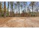 Spacious backyard with wooded area and trampoline at 2138 Rockdale Cir, Snellville, GA 30078