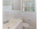 Clean bathroom with white tile, sink, and toilet at 2454 Spring Garden Sw Dr, Atlanta, GA 30315