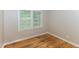 Another view of a bedroom or office space with hardwood floors and neutral walls at 2454 Spring Garden Sw Dr, Atlanta, GA 30315