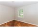 Empty bedroom with hardwood floors and large window at 2454 Spring Garden Sw Dr, Atlanta, GA 30315