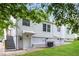 Backyard view of a white, two-story home with a basement entrance at 2454 Spring Garden Sw Dr, Atlanta, GA 30315