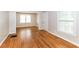 Spacious living room with hardwood floors and plenty of natural light from multiple windows at 2454 Spring Garden Sw Dr, Atlanta, GA 30315