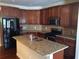 Modern kitchen with granite countertops and dark cabinets at 1213 Lavista Ne Rd, Atlanta, GA 30324