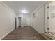 Finished basement space with wood-look flooring and a white brick accent wall at 1852 Shamrock Dr, Decatur, GA 30032