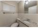 Bathroom with granite countertop, white vanity, and tiled walls at 1852 Shamrock Dr, Decatur, GA 30032
