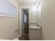 Bathroom with granite vanity, mirror, and open doorway at 1852 Shamrock Dr, Decatur, GA 30032