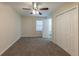 Spacious bedroom with carpet, ceiling fan, and closet at 1852 Shamrock Dr, Decatur, GA 30032