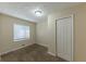 Cozy bedroom with carpeted flooring, a window, and a closet at 1852 Shamrock Dr, Decatur, GA 30032