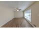 Spacious living room with ample natural light, ceiling fan, and wood-look floors at 1852 Shamrock Dr, Decatur, GA 30032
