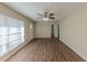 Inviting living room featuring wood-look flooring, abundant natural light, and a ceiling fan at 1852 Shamrock Dr, Decatur, GA 30032