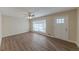 Bright, spacious living room with wood-look flooring and a ceiling fan at 1852 Shamrock Dr, Decatur, GA 30032