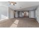 Spacious main bedroom with carpeted floors and multiple closets at 3867 Oakman Pl, Fairburn, GA 30213