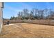 Large backyard with a wooden fence and patio area at 9004 Jim Purcell Dr, Covington, GA 30014