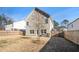 Spacious backyard with a wooden fence and patio at 9004 Jim Purcell Dr, Covington, GA 30014