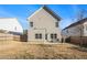 Large backyard with a wooden fence and patio area at 9004 Jim Purcell Dr, Covington, GA 30014