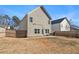Spacious backyard with a wooden fence and patio at 9004 Jim Purcell Dr, Covington, GA 30014