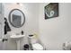 Clean bathroom with pedestal sink, toilet and shower/tub combo at 9004 Jim Purcell Dr, Covington, GA 30014