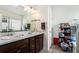 Double vanity bathroom with dark brown cabinets and a shower at 9004 Jim Purcell Dr, Covington, GA 30014