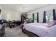 Spacious bedroom with large windows and plush carpet at 9004 Jim Purcell Dr, Covington, GA 30014