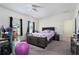 Bright bedroom featuring a comfortable bed and ample closet space at 9004 Jim Purcell Dr, Covington, GA 30014