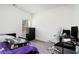 Spacious bedroom with desk, chair, and window at 9004 Jim Purcell Dr, Covington, GA 30014