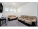 Spacious bonus room with two couches and TV at 9004 Jim Purcell Dr, Covington, GA 30014