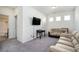 Bonus room with couches, TV, and access to bathroom at 9004 Jim Purcell Dr, Covington, GA 30014