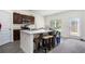 Modern kitchen with island, stainless steel appliances, and white countertops at 9004 Jim Purcell Dr, Covington, GA 30014
