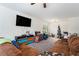 Living room with brown sectional sofa and a Christmas tree at 9004 Jim Purcell Dr, Covington, GA 30014