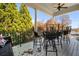 Relaxing porch with seating, ceiling fan, and scenic wooded views at 2111 Cooper Lake Se Rd, Smyrna, GA 30080