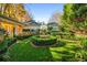 Landscaped backyard with a fountain and lush greenery at 2111 Cooper Lake Se Rd, Smyrna, GA 30080