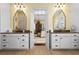Large bathroom featuring dual vanities, granite countertops, and an open doorway leading to the bedroom at 2111 Cooper Lake Se Rd, Smyrna, GA 30080