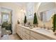 Elegant bathroom with dual vanities, decorative mirrors, and striped wallpaper at 2111 Cooper Lake Se Rd, Smyrna, GA 30080