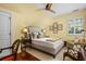 Serene bedroom with tufted headboard, plush bedding, and sitting area at 2111 Cooper Lake Se Rd, Smyrna, GA 30080
